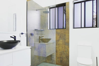 Design ideas for a mid-sized modern bathroom in Wollongong with an open shower.