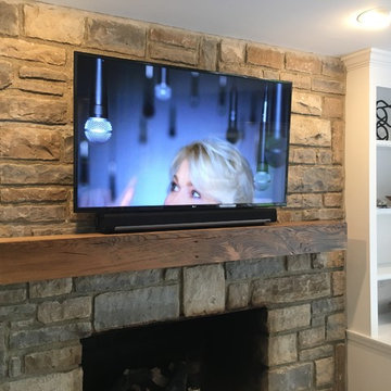 TV Over Fireplace on stone wall