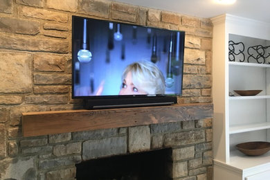 TV Over Fireplace on stone wall