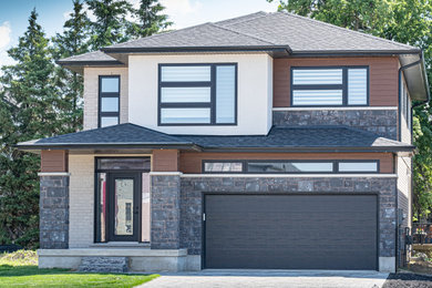 Inspiration for a modern two-story house exterior remodel in Other