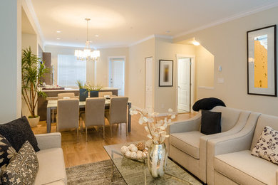 Inspiration for a small contemporary open concept light wood floor living room remodel in DC Metro with beige walls, no fireplace and no tv
