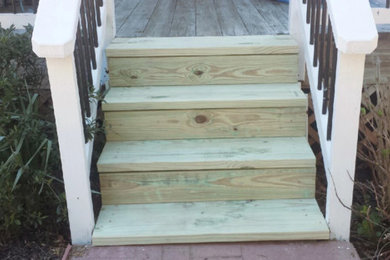 Staircase - mid-sized rustic wooden straight wood railing staircase idea in Atlanta with wooden risers