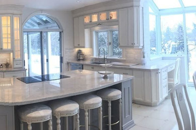 Inspiration for a large timeless single-wall ceramic tile and white floor eat-in kitchen remodel in Toronto with an undermount sink, recessed-panel cabinets, white cabinets, granite countertops, multicolored backsplash, matchstick tile backsplash, paneled appliances, an island and gray countertops