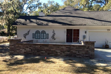 Arts and crafts front yard brick patio photo in Atlanta with no cover