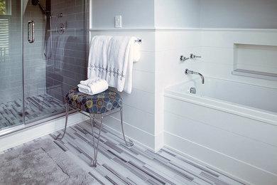 Inspiration for a large transitional 3/4 gray tile and ceramic tile porcelain tile and multicolored floor bathroom remodel in New York with flat-panel cabinets, white cabinets, gray walls, an undermount sink and quartzite countertops