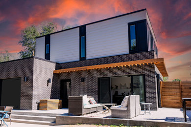 Mid-sized minimalist home design photo in Denver