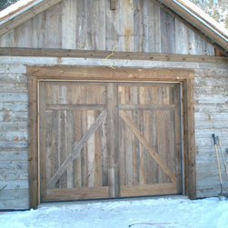 Custom Reclaimed Wood Barn Style Door on Snowy Shed - Interior Doors
