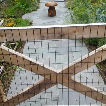 An extensive landscape project with stonewalls, patio, dry river bed & more