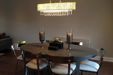 Inspiration for a mid-sized contemporary dark wood floor great room remodel in Toronto with gray walls and no fireplace