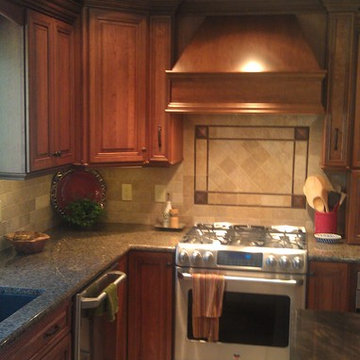 Omega Cabinetry. Destin door, Cherry wood, Nutmeg stain.