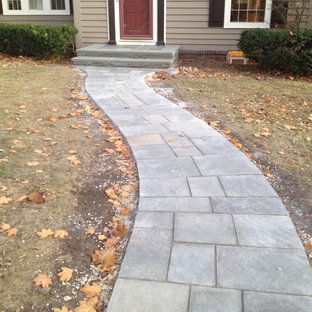 Design ideas for a mid-sized traditional front yard garden in Minneapolis with natural stone pavers and with path.