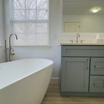 Spacious Bathroom with Dual Vanity and Freestanding Tub