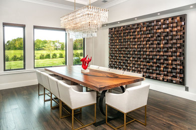Large trendy medium tone wood floor and brown floor enclosed dining room photo in Tampa with white walls and no fireplace