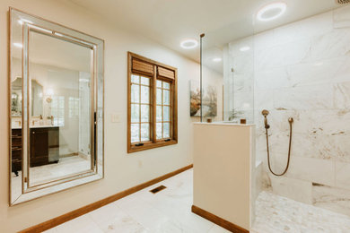 Inspiration for a mid-sized timeless master white tile and marble tile marble floor, white floor and double-sink bathroom remodel in Other with beaded inset cabinets, dark wood cabinets, a one-piece toilet, beige walls, an undermount sink, quartz countertops, a hinged shower door, white countertops and a built-in vanity