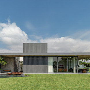 Example of a minimalist exterior home design in Other