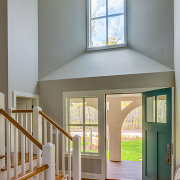 Entryway with Teal Front Door - Boston Magazine Design Home