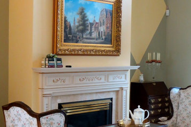 Large elegant formal and enclosed carpeted living room photo in Other with multicolored walls, a standard fireplace and a wood fireplace surround