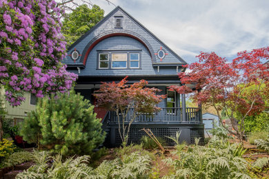Inspiration for a large victorian gray three-story wood house exterior remodel in Portland with a shingle roof