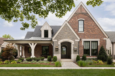 Inspiration for a transitional red two-story brick exterior home remodel in Nashville with a shingle roof and a gray roof
