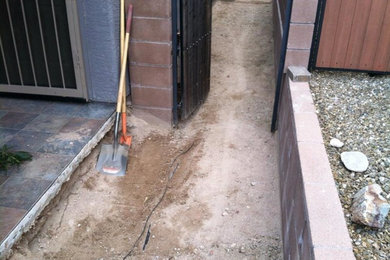 Inspiration for a large southwestern side yard concrete paver patio remodel in Other with no cover