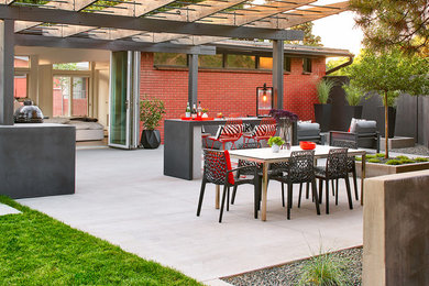 Patio - mid-century modern patio idea in Denver