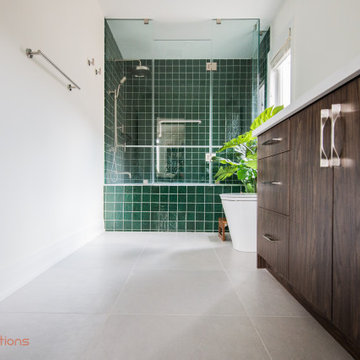Vibrant Green Ceramic Tiles Bring Life to a Hallway Bathroom