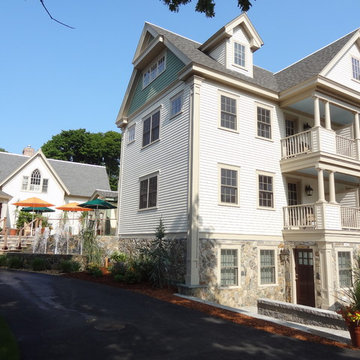 Cape Cod Inn with New England Stone Cladding, Retaining Walls, and Water Feature