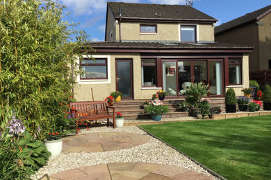 This is an example of a medium sized contemporary conservatory in Glasgow.