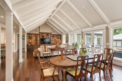 This is an example of a traditional dining room in San Francisco with beige walls and bamboo floors.