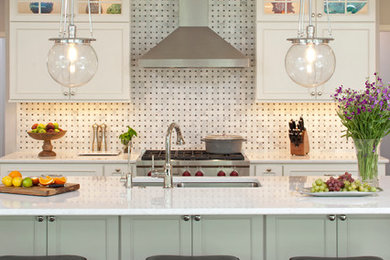 Inspiration for a large timeless u-shaped dark wood floor eat-in kitchen remodel in Minneapolis with an undermount sink, shaker cabinets, white cabinets, multicolored backsplash, stone slab backsplash, stainless steel appliances, an island and quartz countertops