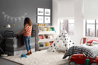 Design ideas for a mid-sized transitional kids' room for boys in San Francisco with concrete floors and multi-coloured walls.