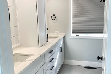 Inspiration for a mid-sized modern kids' porcelain tile, gray floor, double-sink and shiplap wall bathroom remodel in Chicago with shaker cabinets, white cabinets, gray walls, an undermount sink, quartz countertops, white countertops and a built-in vanity