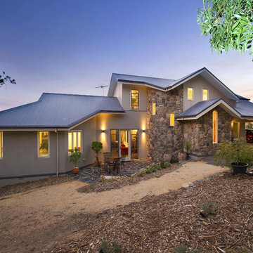 Traditional Exteriors Featuring Stone