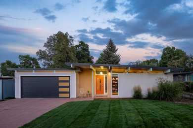1950s gray one-story house exterior photo in Denver with a shed roof