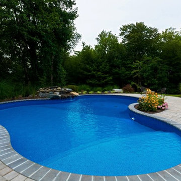 Vinyl pool with Waterfall, Landscape Lighting and Landscaping