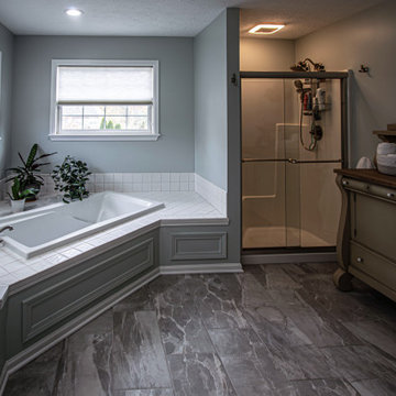 White Master Bath with Pepper Leathered Quartz Countertops