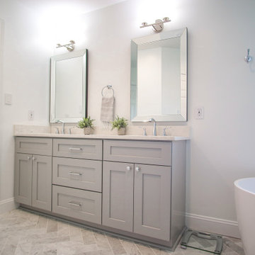 Double Vanity with Light Gray Cabinetry and Framed Mirrors