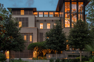 Design ideas for a three-storey beige house exterior in Charleston.
