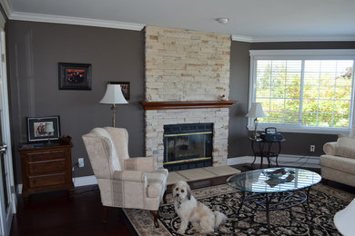 Mid-sized elegant formal dark wood floor and brown floor living room photo in Vancouver with gray walls, a standard fireplace and a stone fireplace