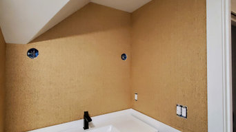 Wallpapering in a bathroom with grasscloth material