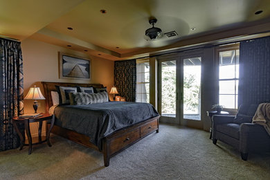 Photo of a large traditional guest bedroom in Boston with beige walls and carpet.