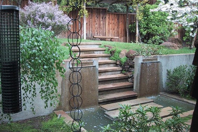 Inspiration for a large traditional full sun backyard stone landscaping in San Francisco.