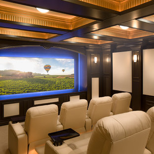 Elegant enclosed carpeted and beige floor home theater photo in Sacramento with white walls and a projector screen