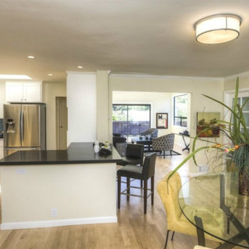 Maple Flooring throughout unifies the space