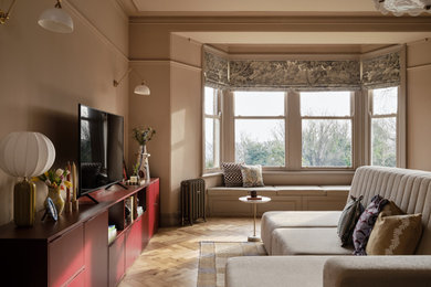 Contemporary living room in Other with brown walls, light hardwood flooring and beige floors.