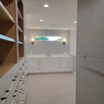 Two separate bathrooms converted into a master bathroom with a big open closet