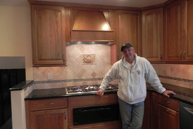 Example of a mid-sized classic home design design in Philadelphia