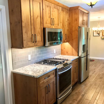 Dura Supreme Cabinets Knotty Alder Butternut Romanix Granite Galley Kitchen