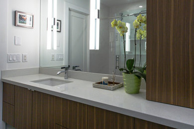 Bathroom - mid-sized contemporary master black tile and porcelain tile porcelain tile and black floor bathroom idea in Vancouver with an undermount sink, flat-panel cabinets, medium tone wood cabinets, quartz countertops, a two-piece toilet and white walls