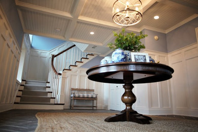 Design ideas for a mid-sized traditional foyer in Baltimore with blue walls, ceramic floors and grey floor.